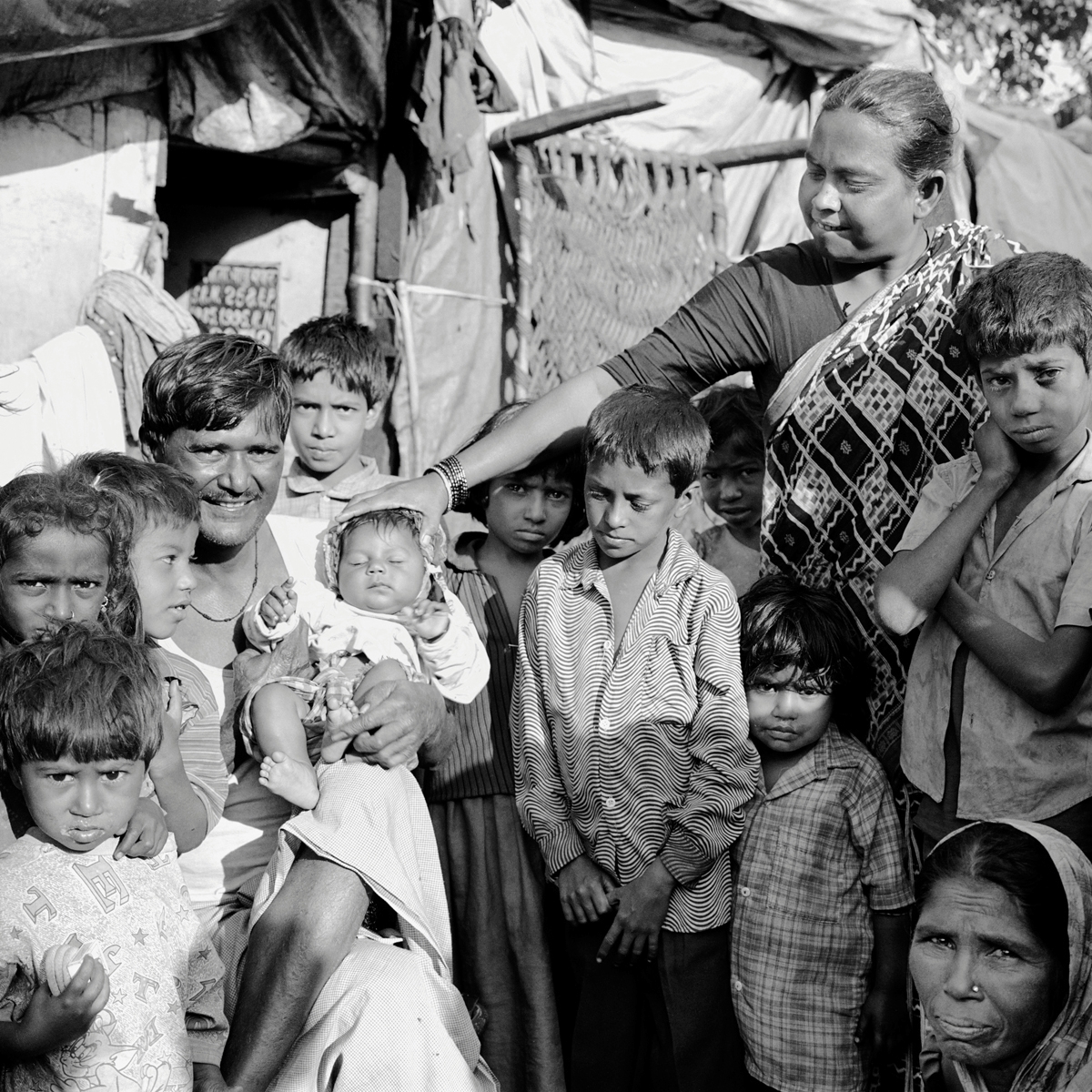 A family and neighbors along P. D'Mello Road, Mumbai, Maharashtra.